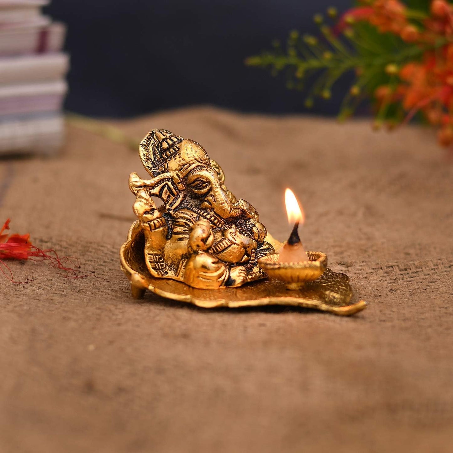 Ganesha on Leaf with Diya