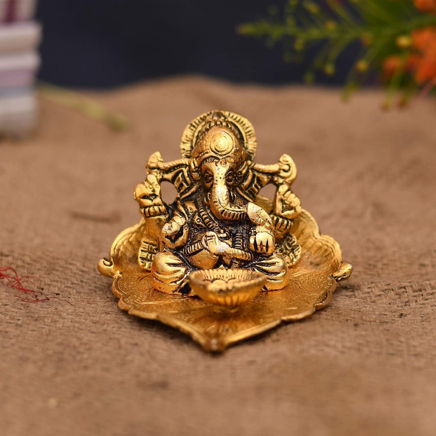 Ganesha on Leaf with Diya