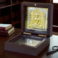 Jain Tirthankar Yantra in a polished wooden box with gold and silver plating, symbolizing peace and prosperity.