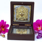 Jain Tirthankar Yantra in a polished wooden box with glass windows, featuring 24K gold and silver plating.