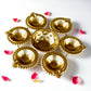 7-inch decorative mini urli bowl with 6 brass diya holders, perfect for Indian festive and pooja decor.