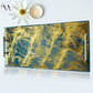 Decorative tray with gold and blue marbled design, white flower, and candle on a white background