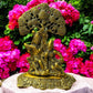 Brass Radha Krishna Idol under intricately carved tree, antique finish, perfect for home decor and spiritual gifting.